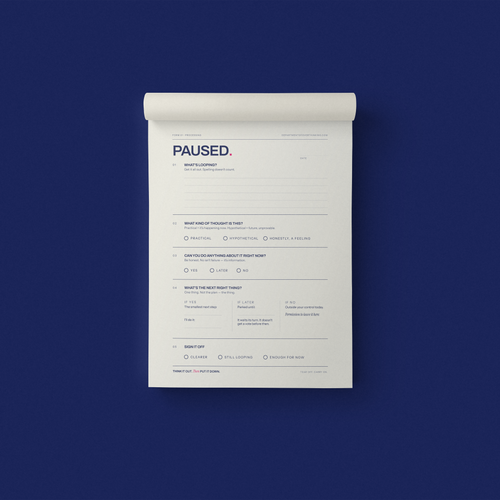 PAUSED. guided A5 notepad sheet on a navy background