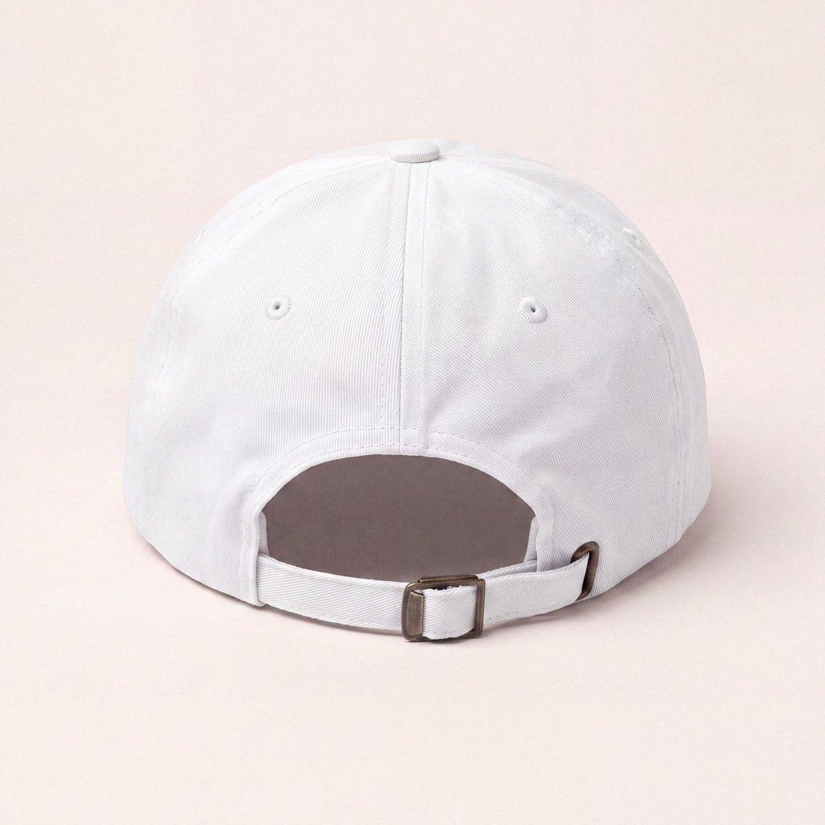Back view of white embroidered baseball cap with adjustable strap