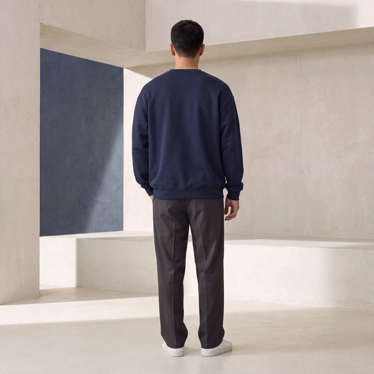 Back view of navy SENSITIVE BY DESIGN. crewneck sweatshirt