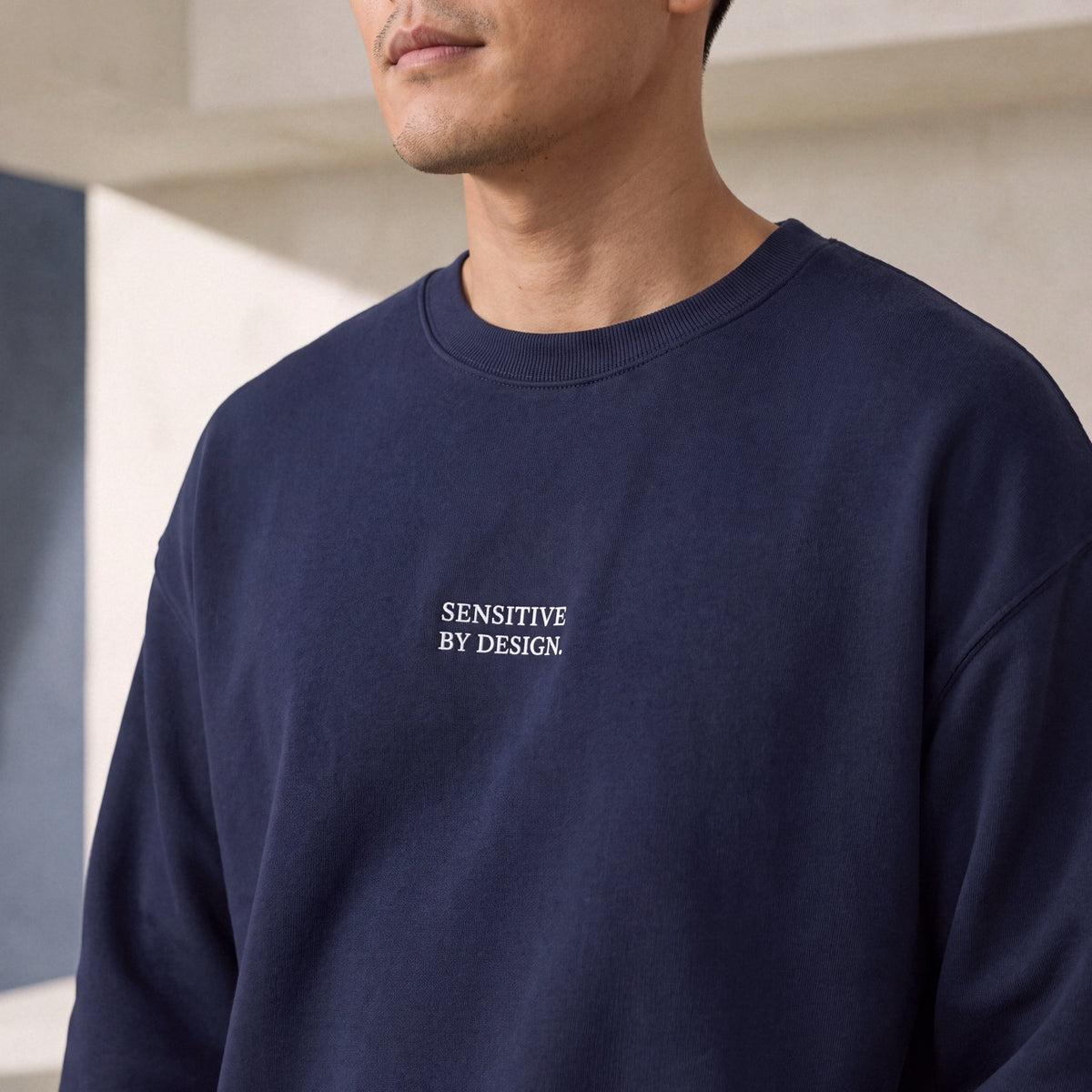 Close-up of navy Department of Overthinking embroidered crewneck sweatshirt